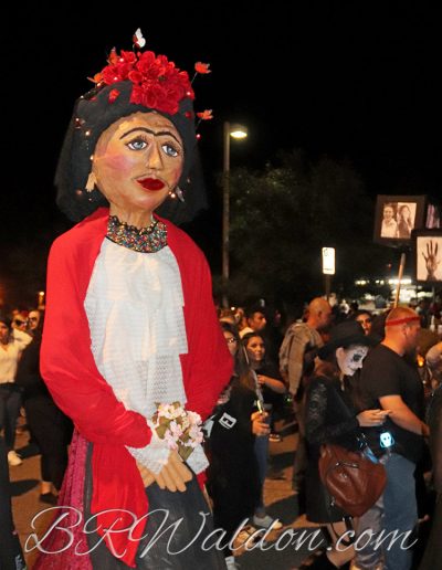 A calaca walks in the Tucson All Souls procession